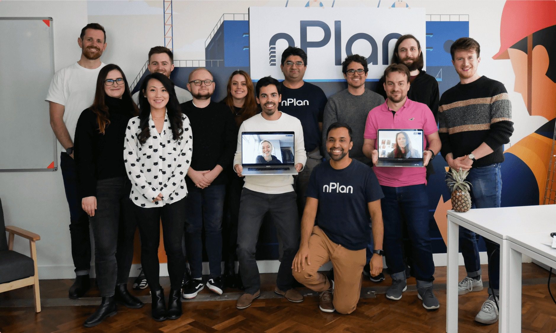 Group of people holding laptops