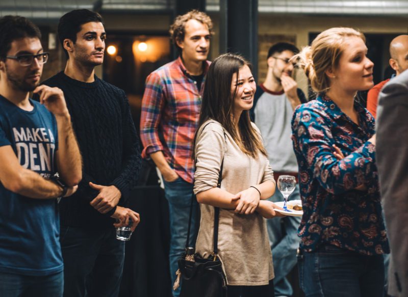 Group of people standing and listening
