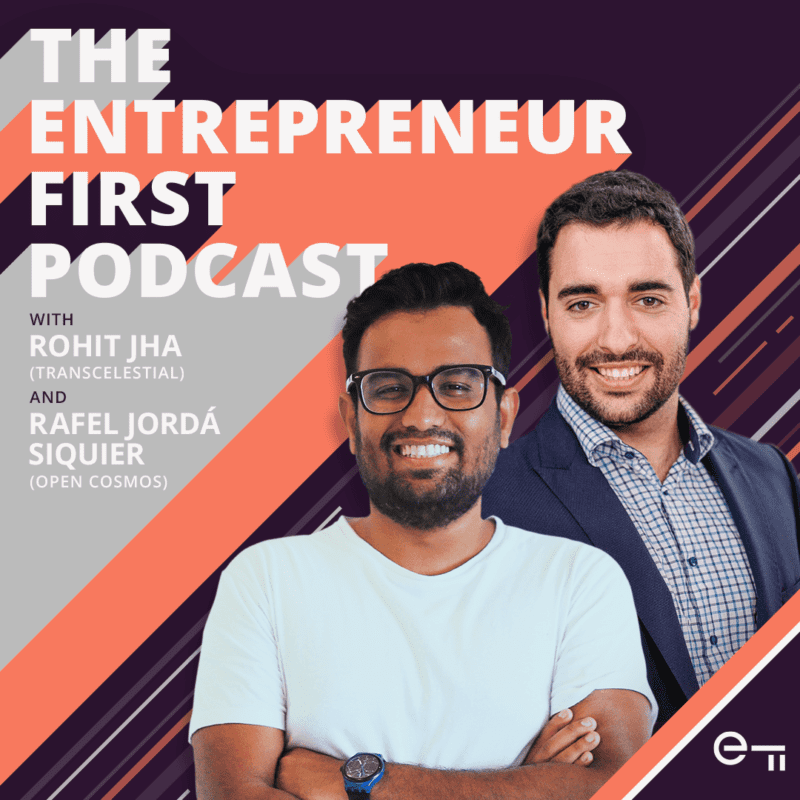 Two men smiling