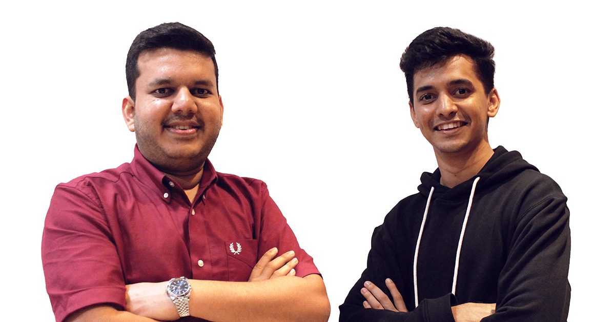 Two men smiling