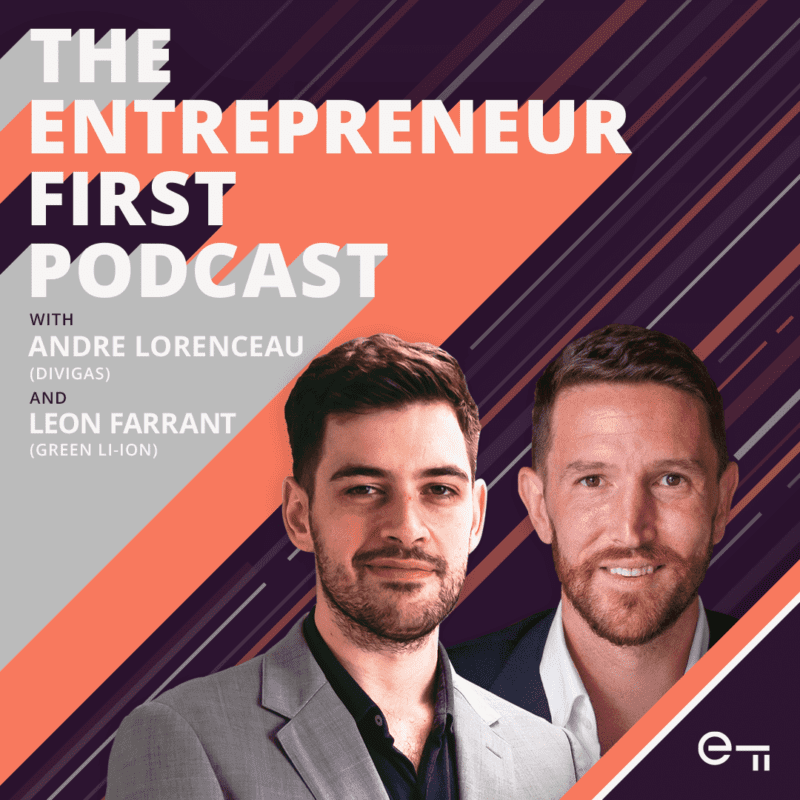 Two men smiling
